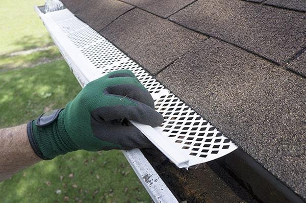 gutter guards are designed to allow water to flow into the gutters while blocking leaves, twigs, and other debris from entering